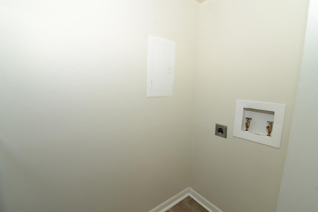 clothes washing area featuring hardwood / wood-style flooring, washer hookup, and hookup for an electric dryer