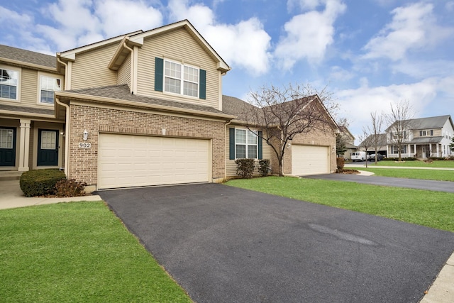 view of front facade featuring a garage and a front lawn