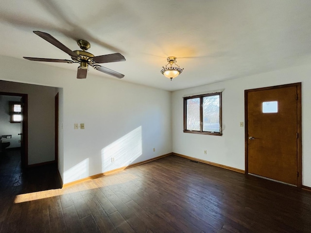 unfurnished room featuring dark hardwood / wood-style flooring and ceiling fan