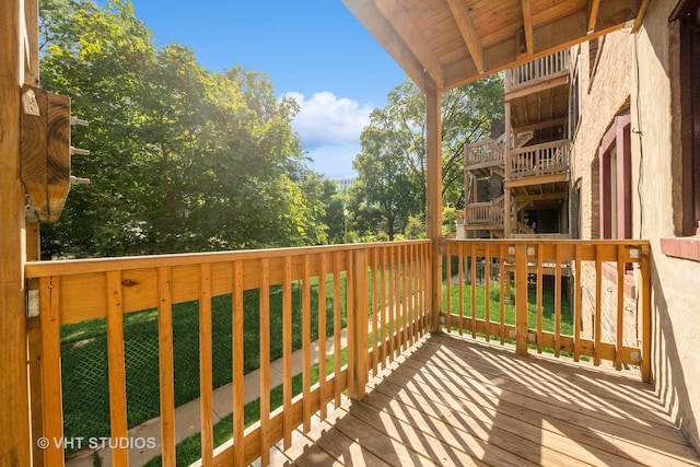 wooden deck with a yard