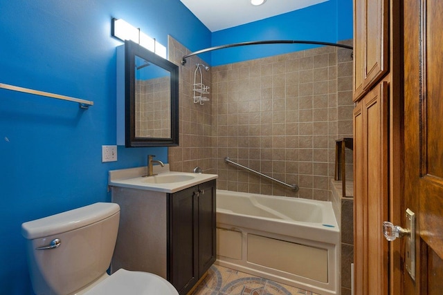 full bathroom with vanity, toilet, and tiled shower / bath