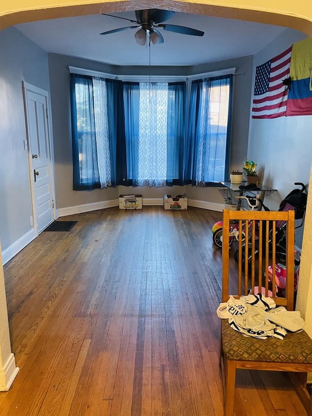 interior space featuring hardwood / wood-style floors and ceiling fan