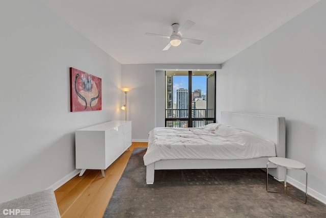 bedroom with hardwood / wood-style flooring and ceiling fan