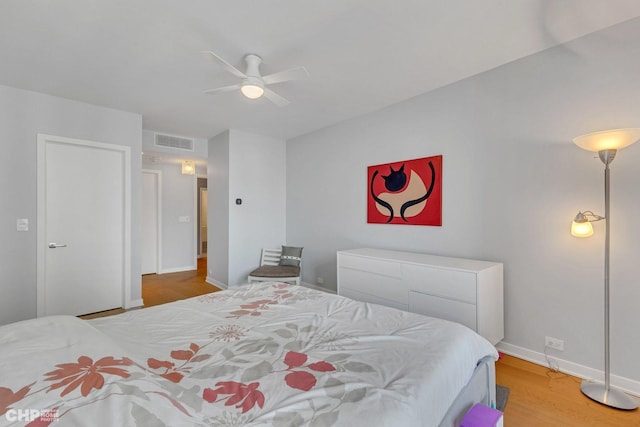 bedroom featuring ceiling fan and hardwood / wood-style floors