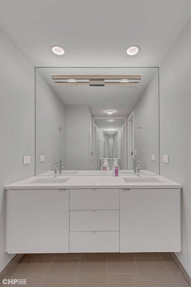 bathroom featuring tile patterned flooring and vanity