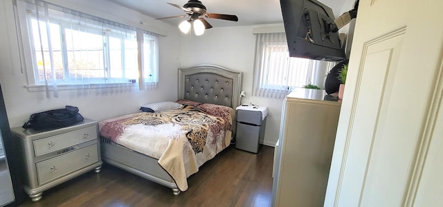 bedroom featuring dark hardwood / wood-style floors and ceiling fan