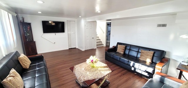 living room with dark hardwood / wood-style floors