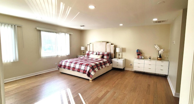 bedroom with light hardwood / wood-style floors