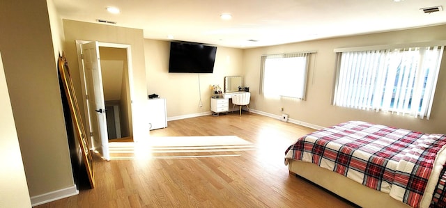 bedroom featuring wood-type flooring