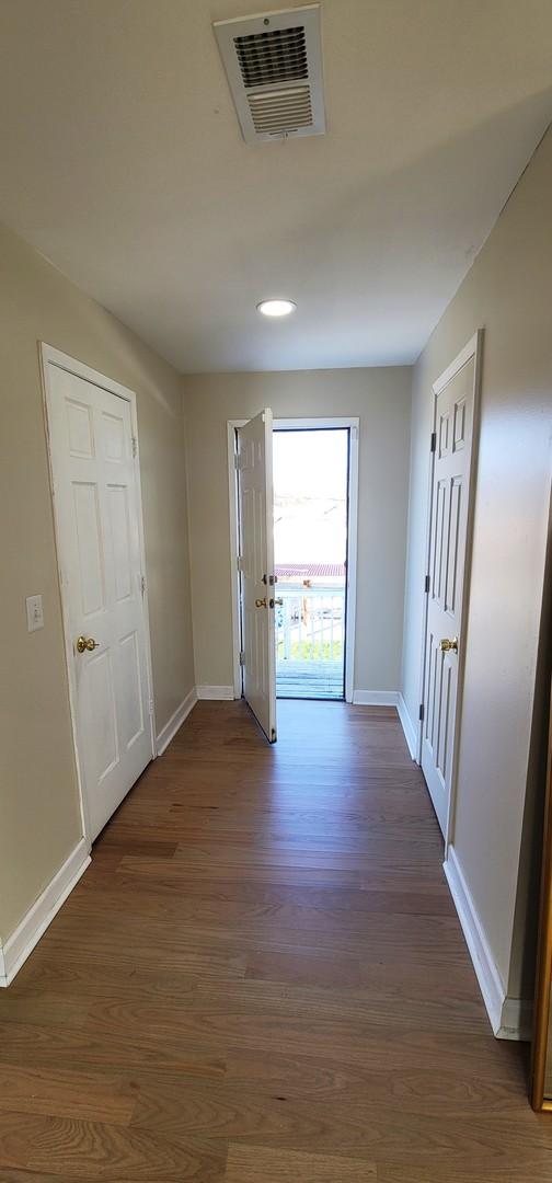 hallway featuring dark hardwood / wood-style floors