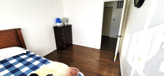 bedroom featuring dark hardwood / wood-style floors