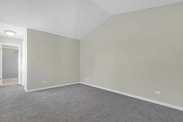 bonus room with lofted ceiling and carpet