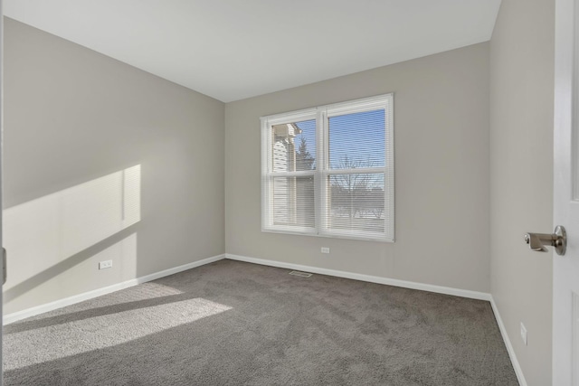 unfurnished room featuring carpet flooring