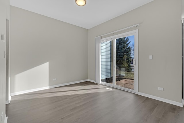 unfurnished room with light wood-type flooring