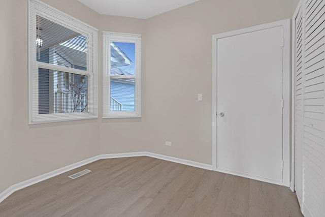 unfurnished room with light hardwood / wood-style flooring