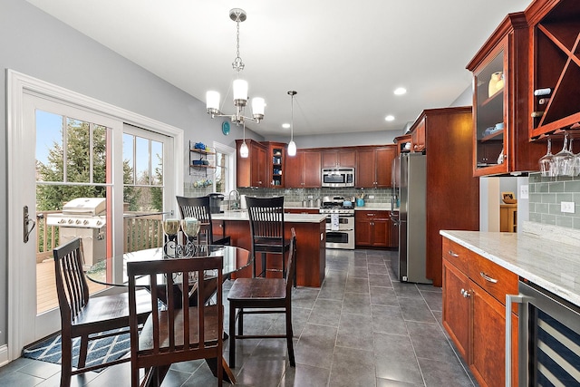 dining area with wine cooler, sink, and a chandelier