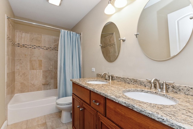 full bathroom featuring tile patterned flooring, shower / bath combination with curtain, vanity, and toilet