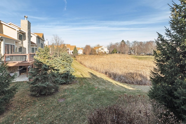 view of yard featuring a wooden deck