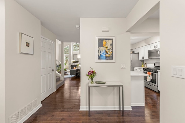 hallway featuring dark wood-type flooring