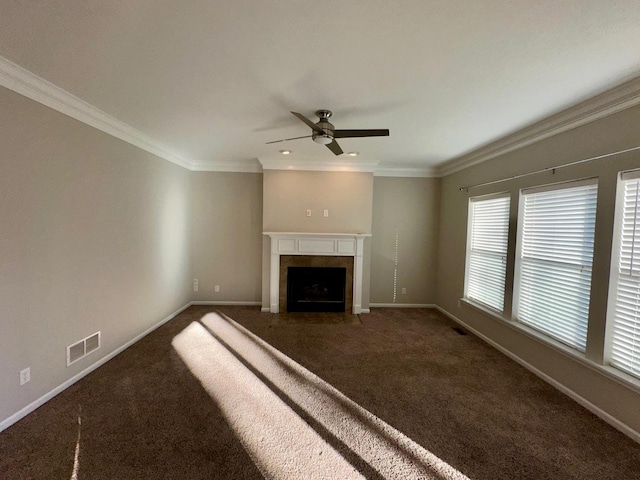 unfurnished living room featuring ceiling fan, dark carpet, and ornamental molding