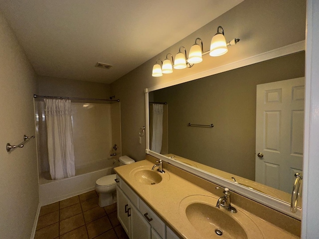 full bathroom featuring tile patterned floors, vanity, toilet, and shower / bath combo with shower curtain