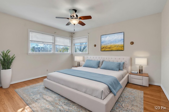 bedroom with ceiling fan and light hardwood / wood-style floors