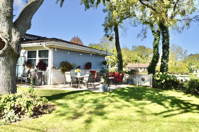 view of yard featuring a patio and fence