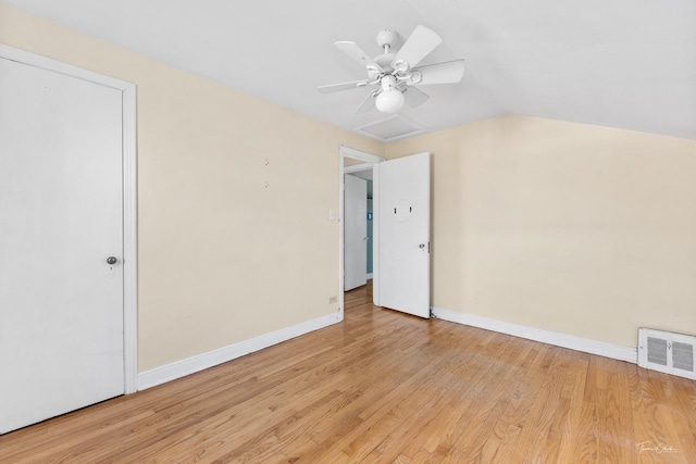 unfurnished bedroom featuring ceiling fan, light hardwood / wood-style floors, and lofted ceiling