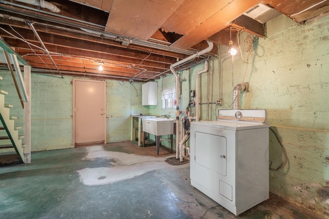 basement featuring washer / clothes dryer and sink