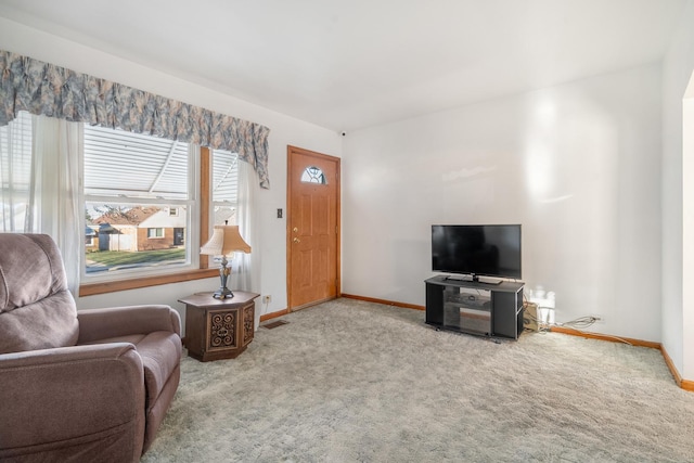 living room featuring light carpet