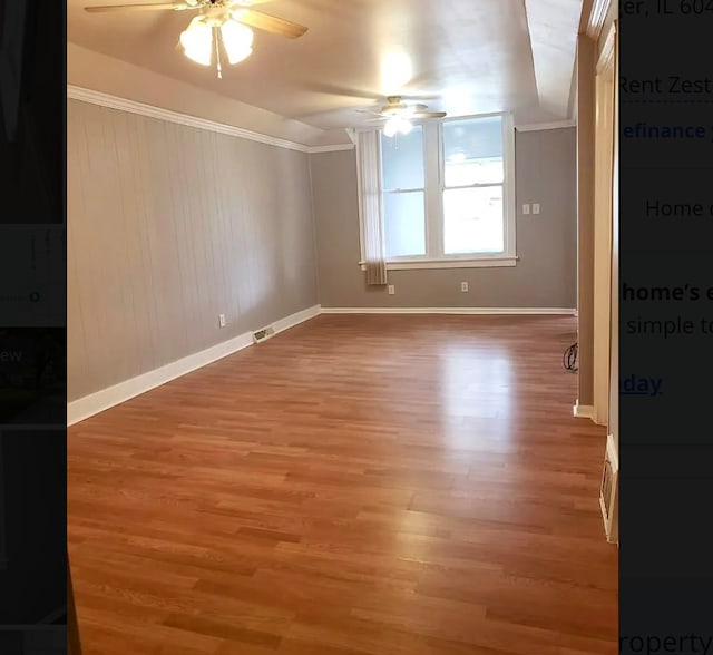 spare room featuring ceiling fan, wood-type flooring, and ornamental molding