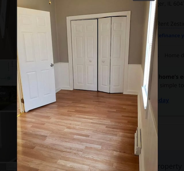 unfurnished bedroom with light hardwood / wood-style floors