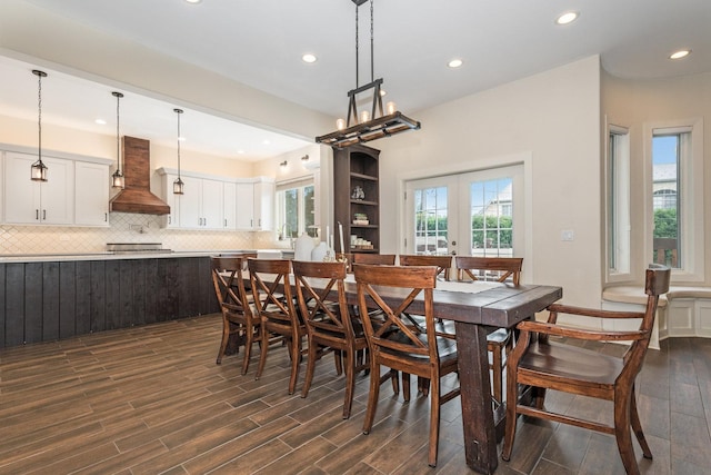 dining space featuring french doors and dark hardwood / wood-style flooring