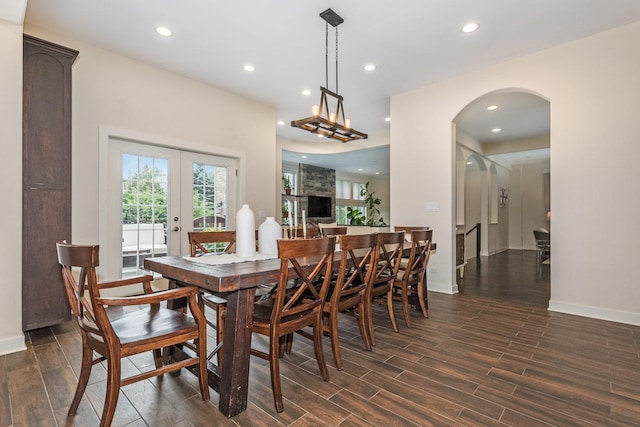 dining room with french doors and dark hardwood / wood-style flooring