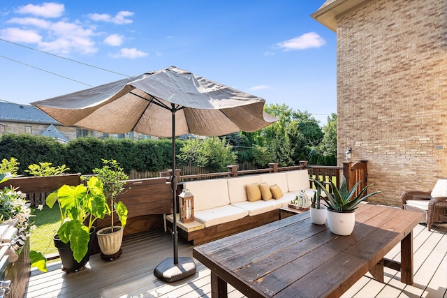 deck featuring outdoor lounge area