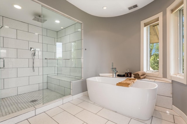 bathroom with plus walk in shower and tile patterned floors