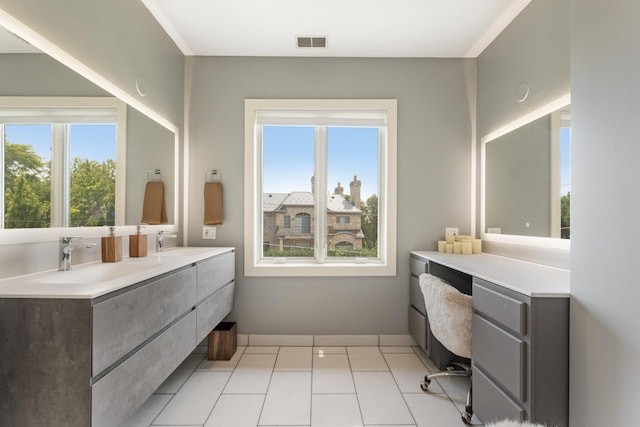 bathroom featuring tile patterned flooring and vanity