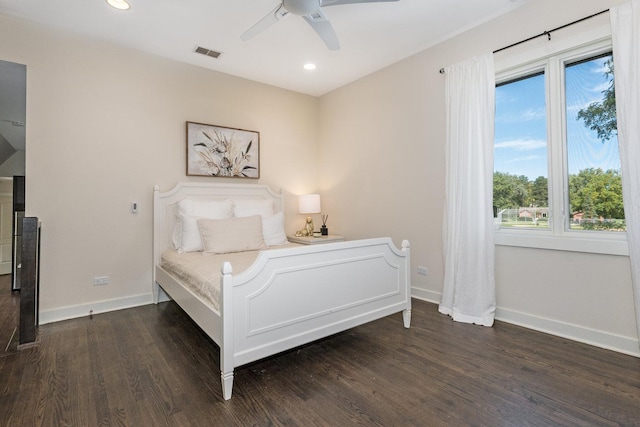 bedroom featuring ceiling fan and dark wood-type flooring