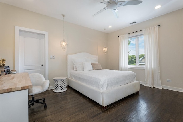 bedroom with ceiling fan and dark hardwood / wood-style floors