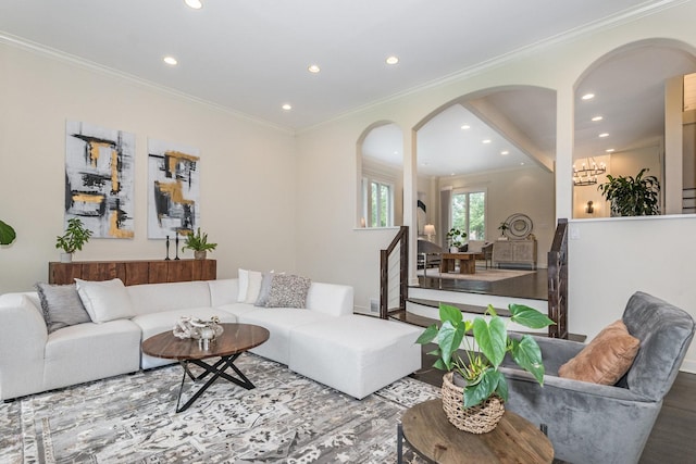 living room featuring light hardwood / wood-style flooring and crown molding