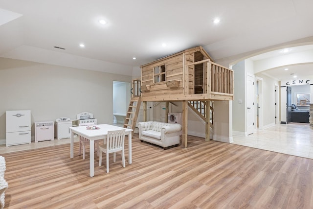 interior space with separate washer and dryer and light hardwood / wood-style flooring