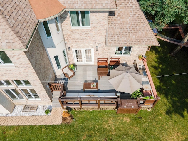 rear view of property featuring an outdoor living space and a patio area