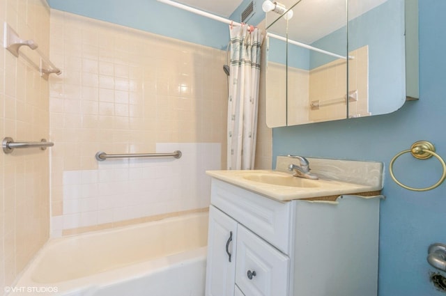 bathroom with vanity and shower / bath combo with shower curtain