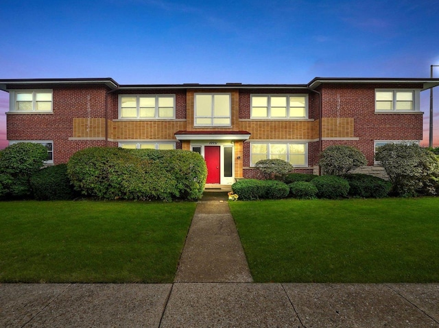 view of front of home with a yard