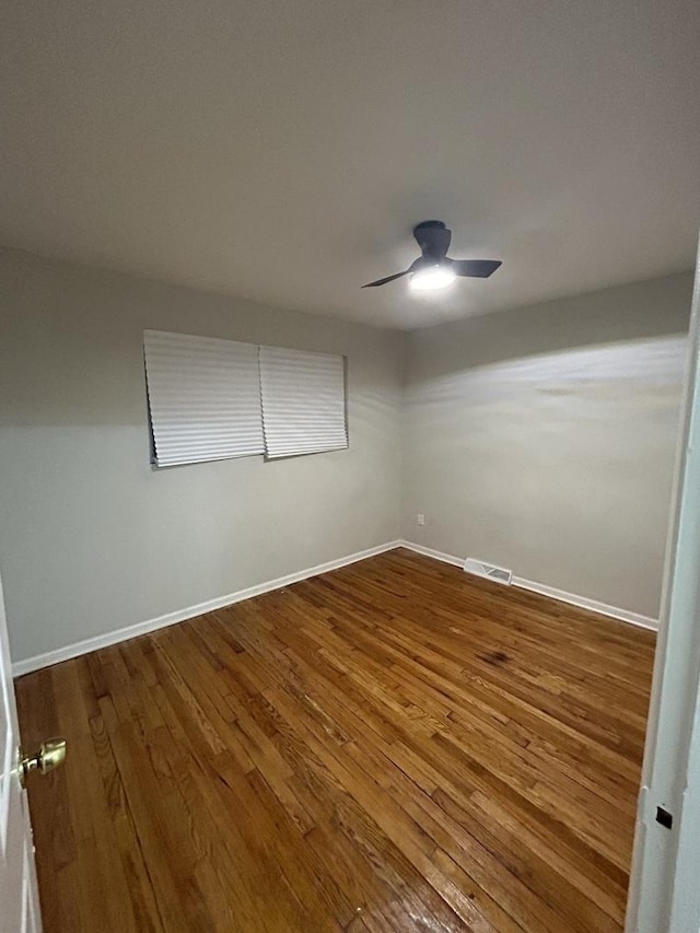 unfurnished room with wood-type flooring and ceiling fan