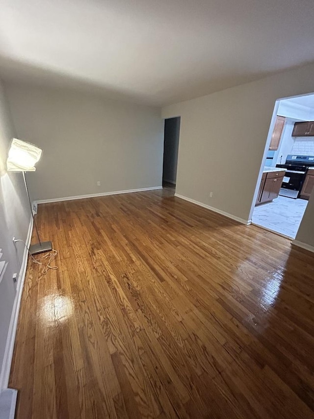 unfurnished living room featuring hardwood / wood-style floors