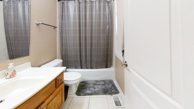 full bathroom featuring toilet, vanity, tile patterned floors, and shower / bathtub combination with curtain