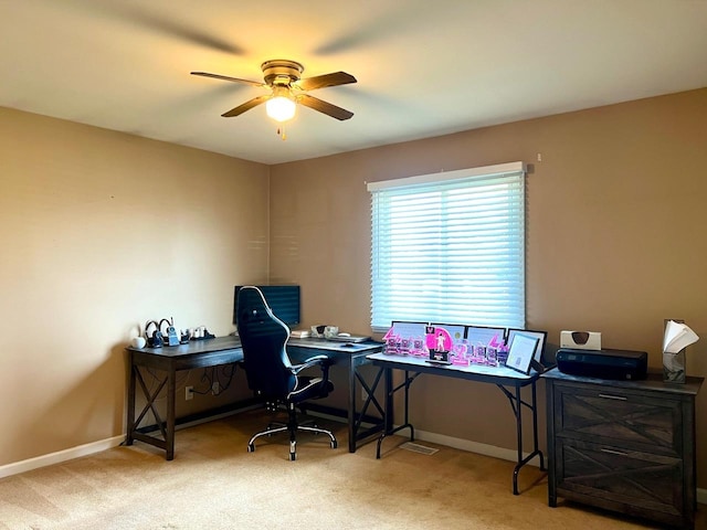 carpeted office with ceiling fan