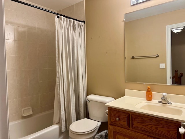 full bathroom with vanity, shower / bath combo, and toilet