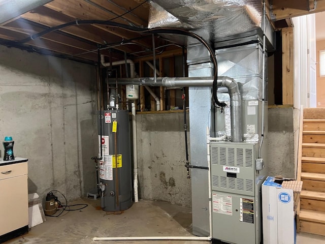 utility room featuring water heater